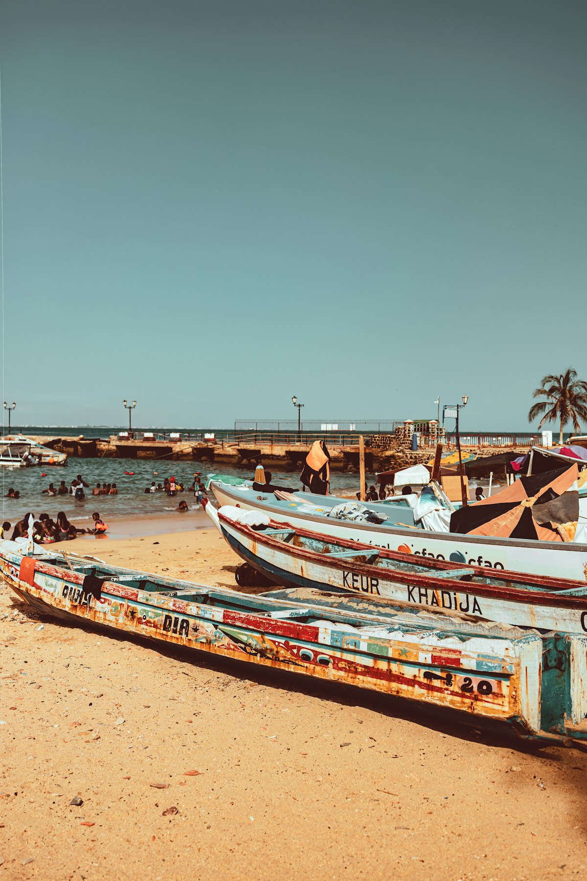 Painted fishing pirogues on a beach on the West African coast